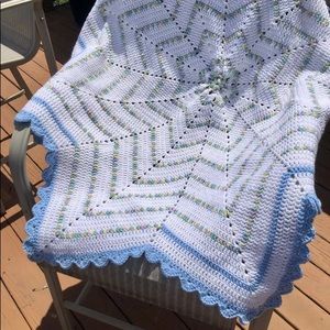 Handmade Star Crochet Afghan in the colors: baby mix, white, and blue.